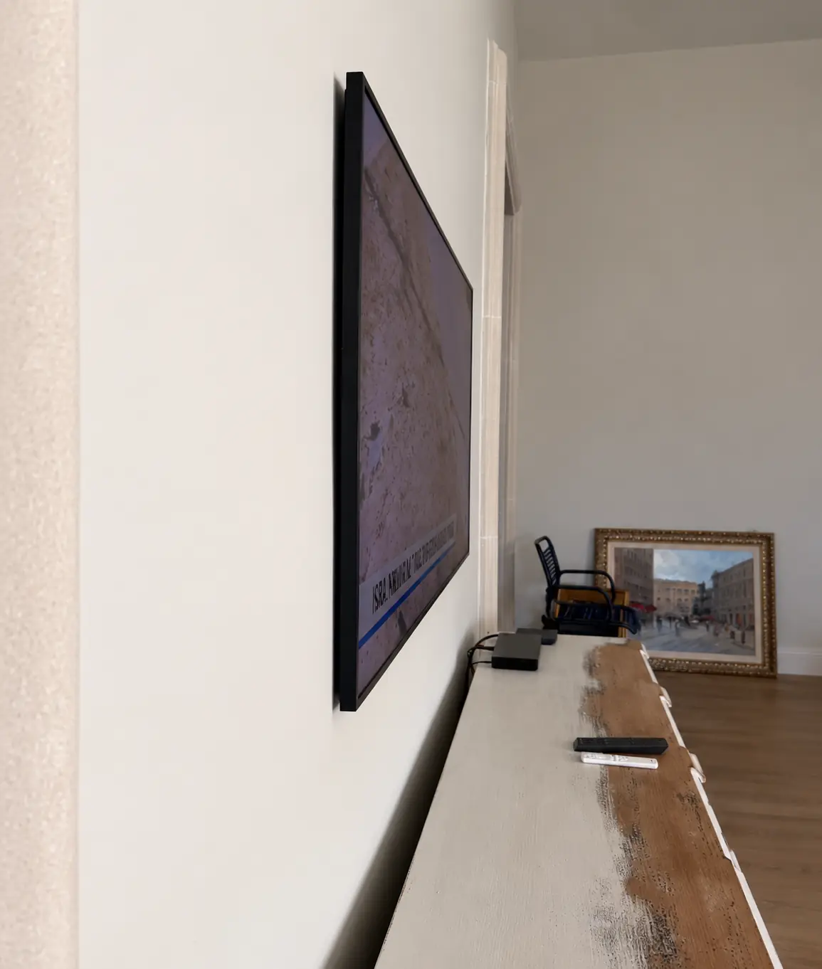 Side view of a television mounted close to the wall